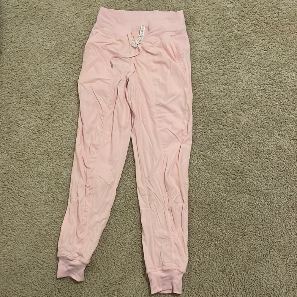 Pink Lululemon sweat pants/ Joggers worn once for a quince. Size 4